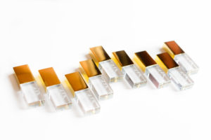 Glass usb drives with gold caps arranged in a staggered line