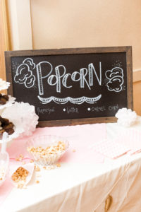 Chalkboard sign with the word popcorn written on it at Little Birds Photography's Glitter & Glam Night