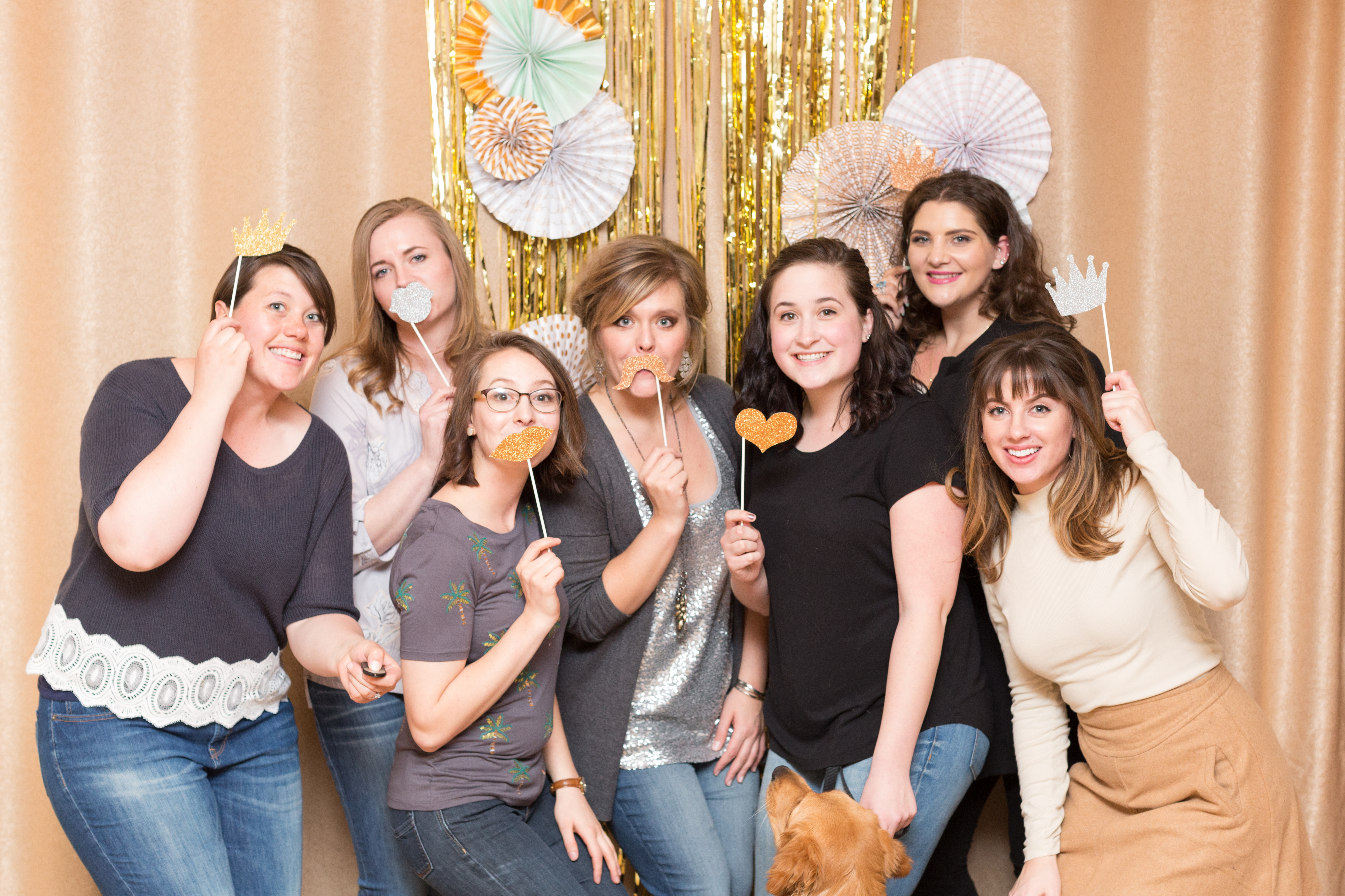 Group of seven ladies pose in the photo booth at Little Birds Photography's Glitter & Glam Night
