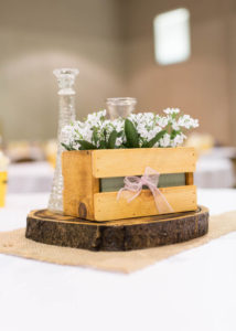 center piece with a small wooden box with flowers
