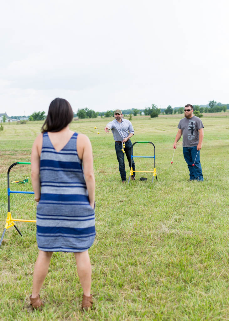 Guests play ladder golf on the lawn 