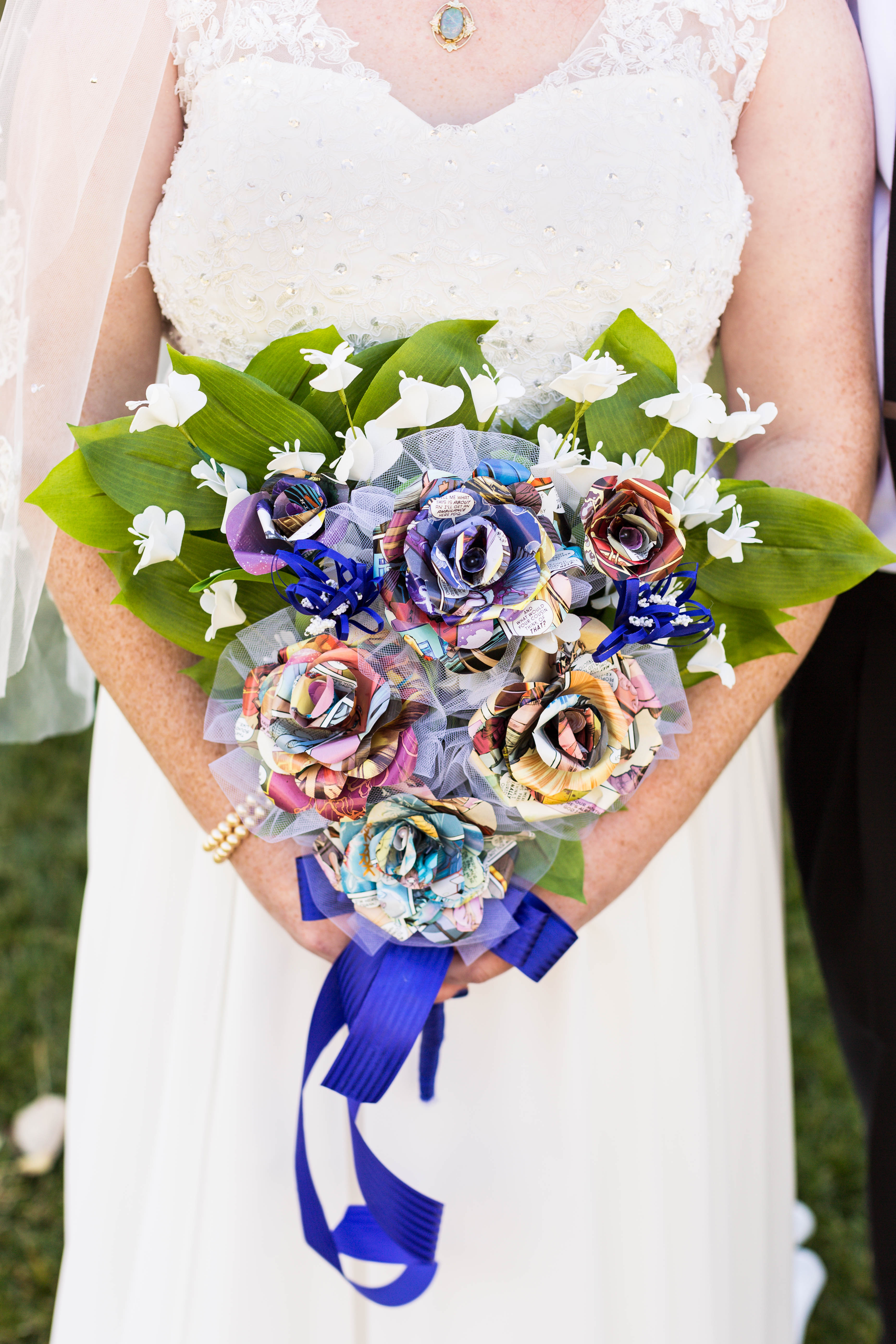 closeup of bridal bouquet made out of colorful comic strips