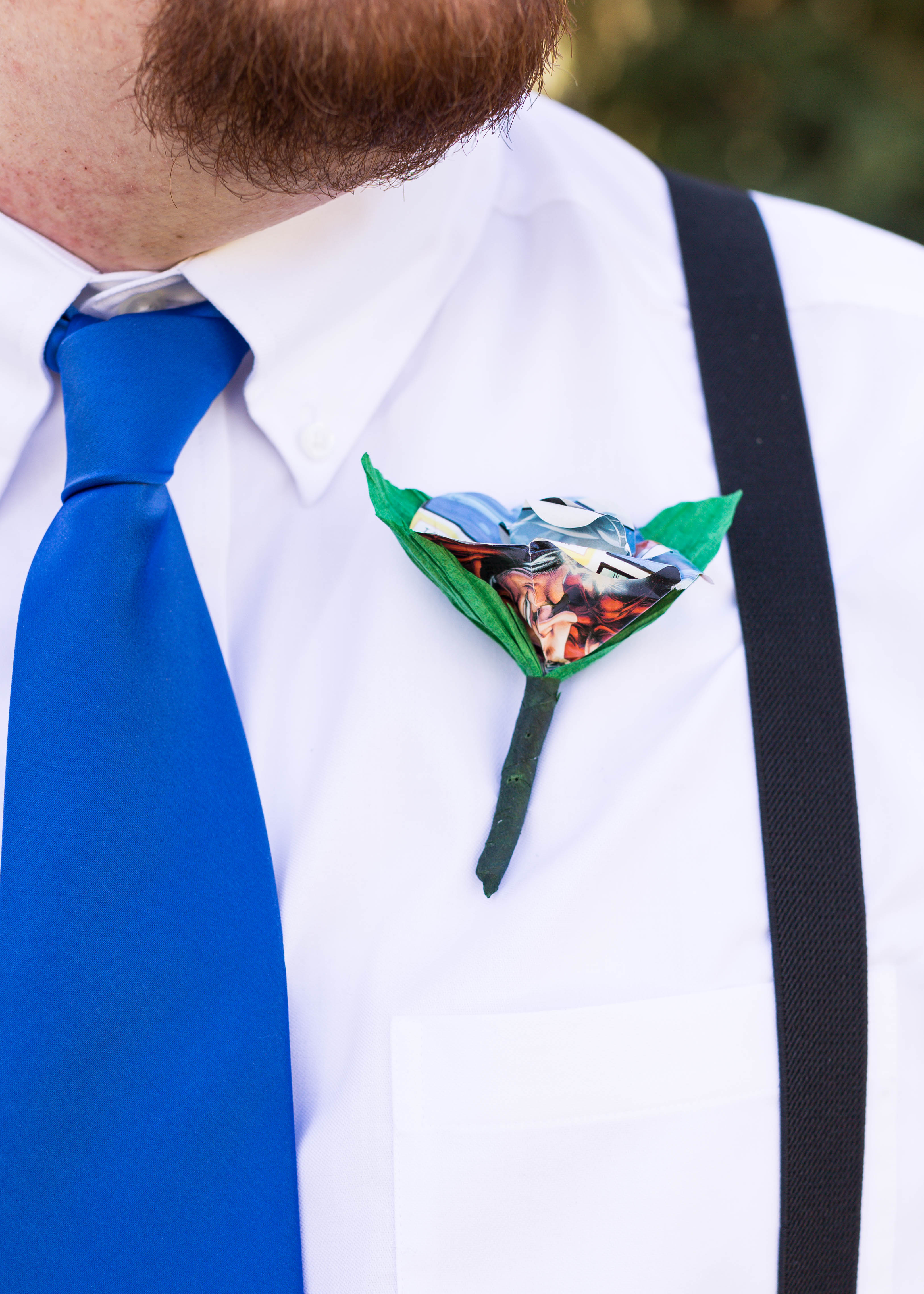 groom's boutonniere made out of colorful comic strip paper