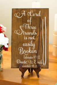 wooden sign with three cords and Ecclesiastes 4:9-12 written on it