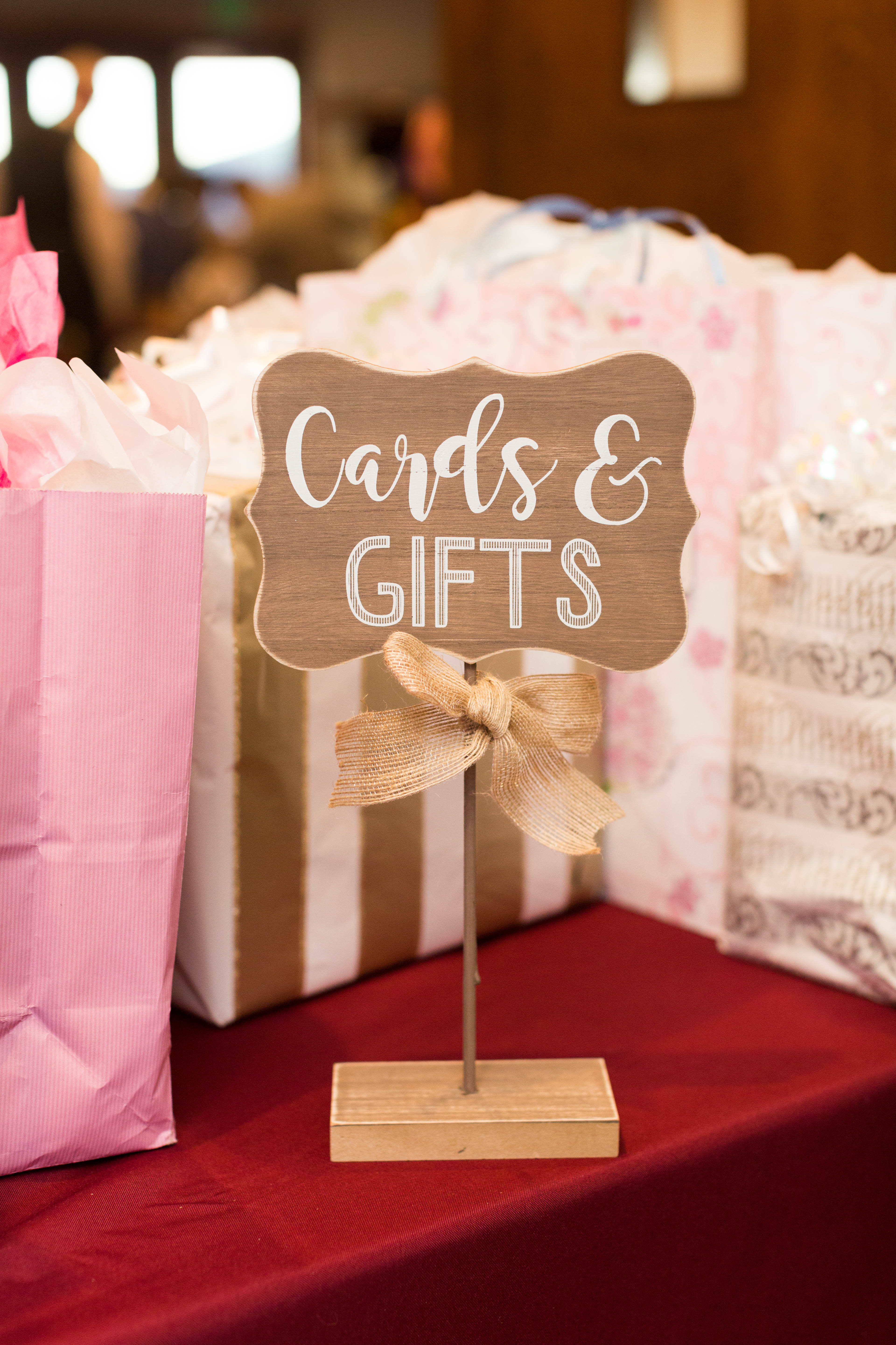 wooden sign at the card and gifts table
