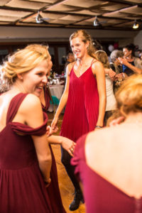 girl smiles while dancing at reception