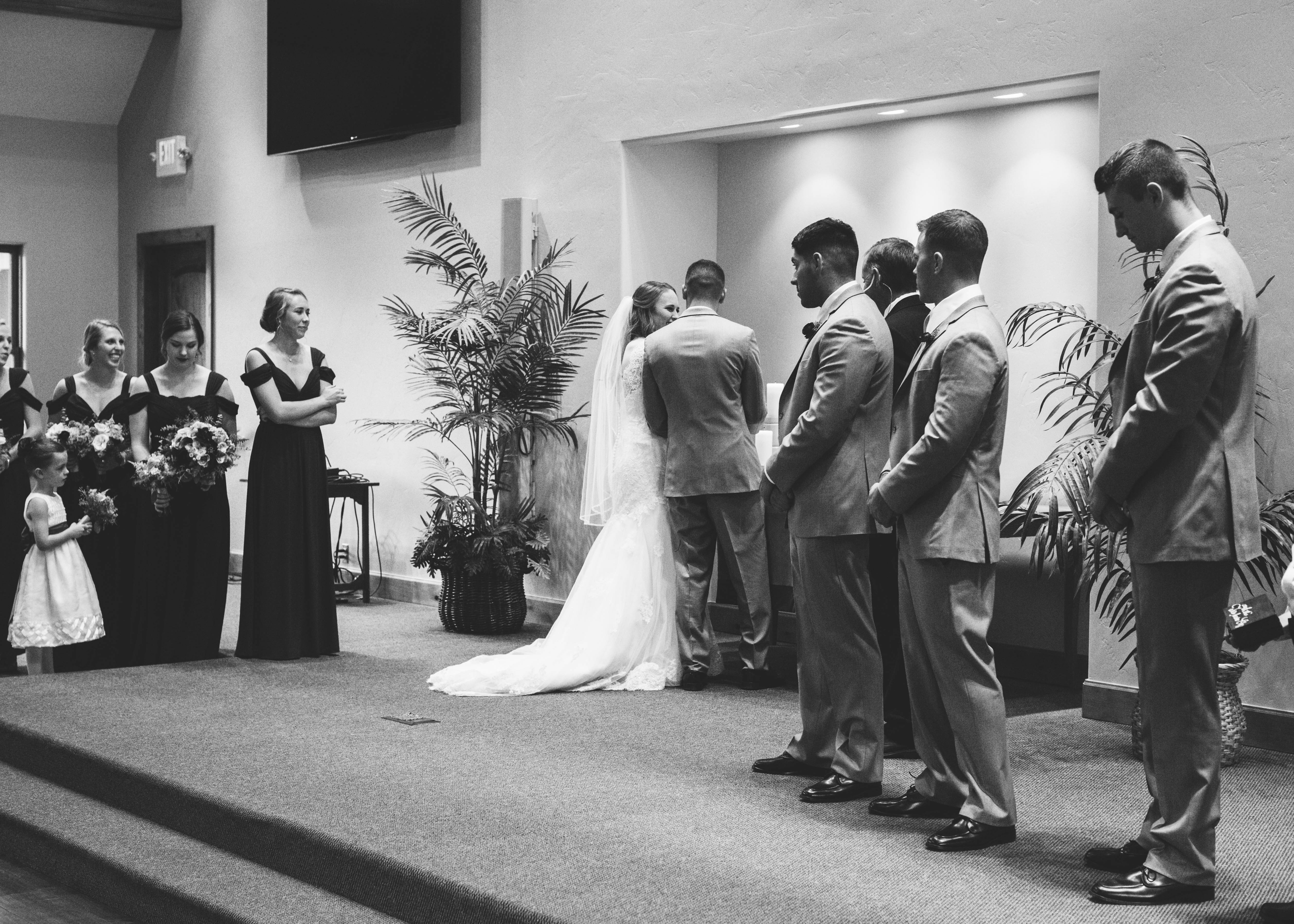 bride and groom tie strand of three chord together during ceremony