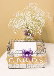 wire basket for cards decorated with ribbon and burlap