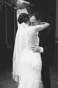 bride and groom embrace during first look