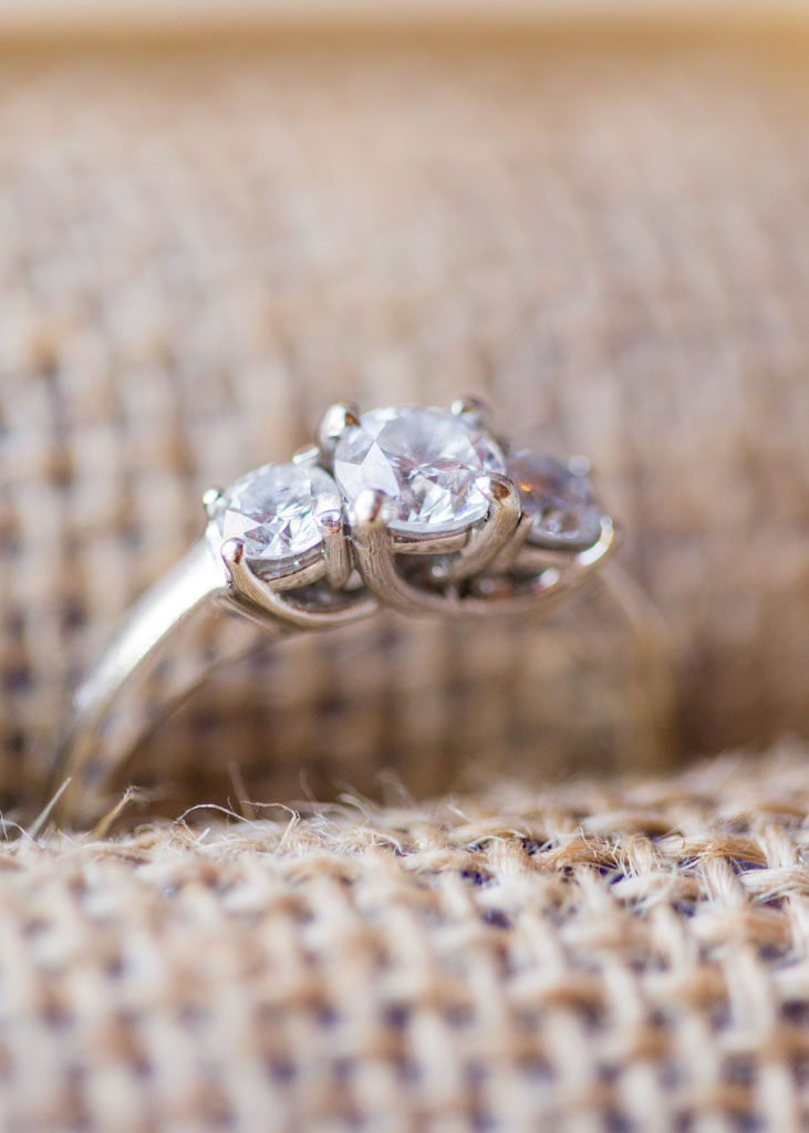 side view of the elegant setting of a three stone wedding ring
