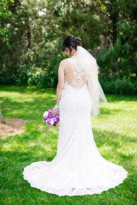 bride with her back turned showing off the back of her dress