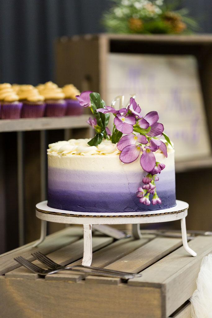 wedding cake decorated with white and purple frosting