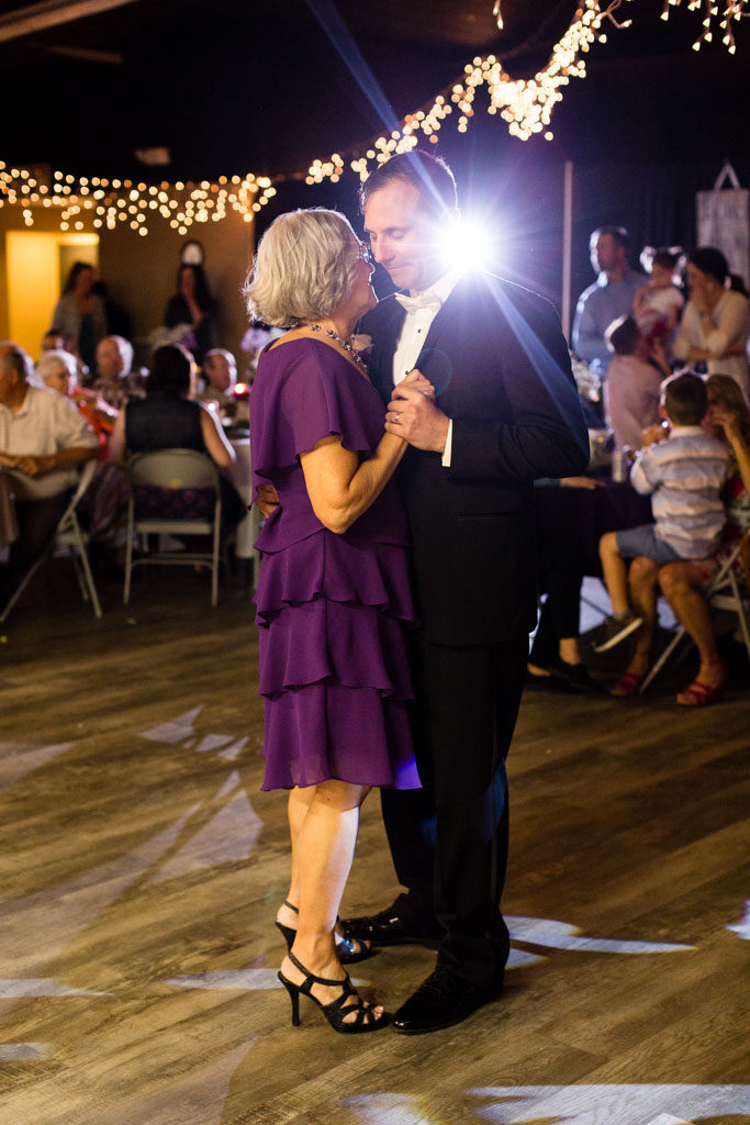 groom dances with mom at reception