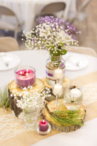 center piece decorated with baby's breath and candles